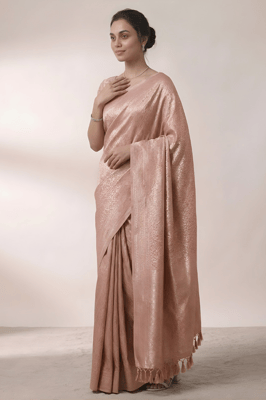 Kanjeevaram (Kanchipuram) Silk Saree in a soft rose gold or copper-toned metallic shade.