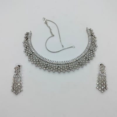 silver-toned crystal necklace and earring set,