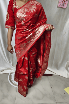 elegant red Banarasi silk saree features intricate gold zari work 