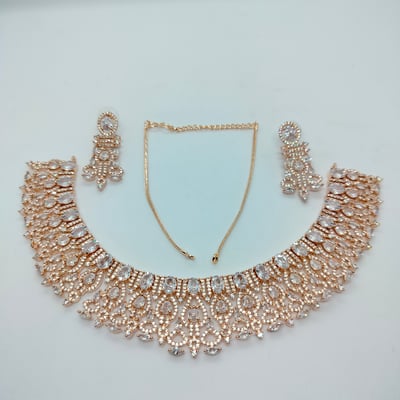 appears necklace,earrings a rose gold plating.  